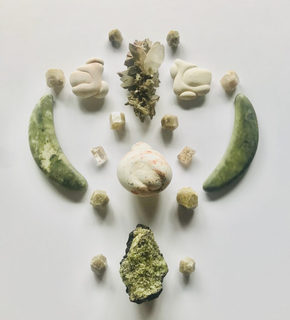 Menalite, Grossular, Rutilated Quartz, Chlorite Quartz, Nephrite, Olivine on Matrix